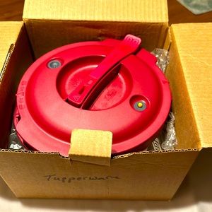 Brand new microwaveable Tupperware pressure cooker.